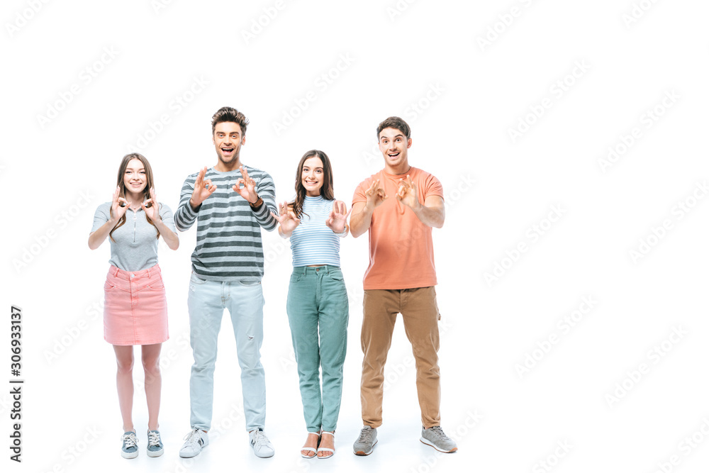 excited friends showing ok signs isolated on white excited friends showing ok signs isolated on white