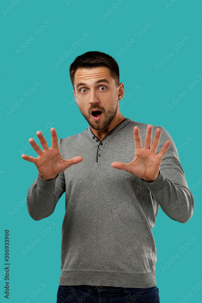 portrait of scared bearded man isolated on blue background. I'm afraid. portrait of scared bearded man isolated on blue background. I'm afraid.