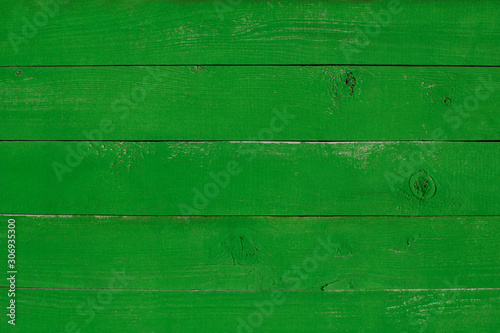 Bright green wooden painted background texture. Old plank backdrop.