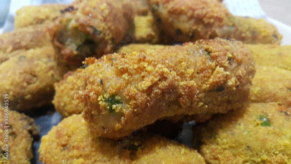 Spicy and delicious fried croquettes with a closeup perspective view Spicy and delicious fried croquettes with a closeup perspective view