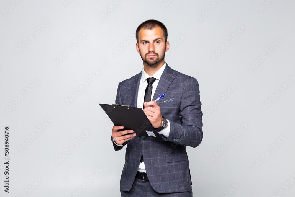 Young businessman make notice on blank isolated on white background Young businessman make notice on blank isolated on white background