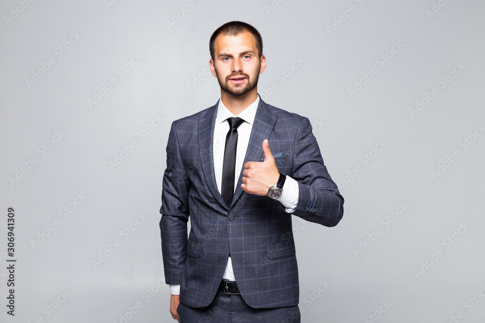 Young business man going thumb up, isolated on white background Young business man going thumb up, isolated on white background
