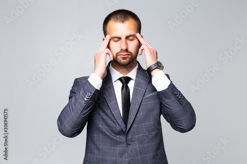 Handsome business man thinking over white background