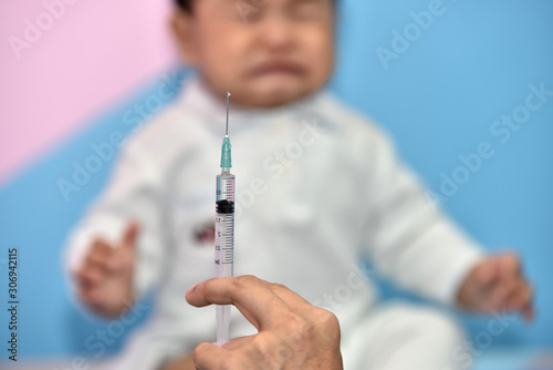 Children are crying and scared.doctors and children who are treated. Children get vaccinated at the hospital.