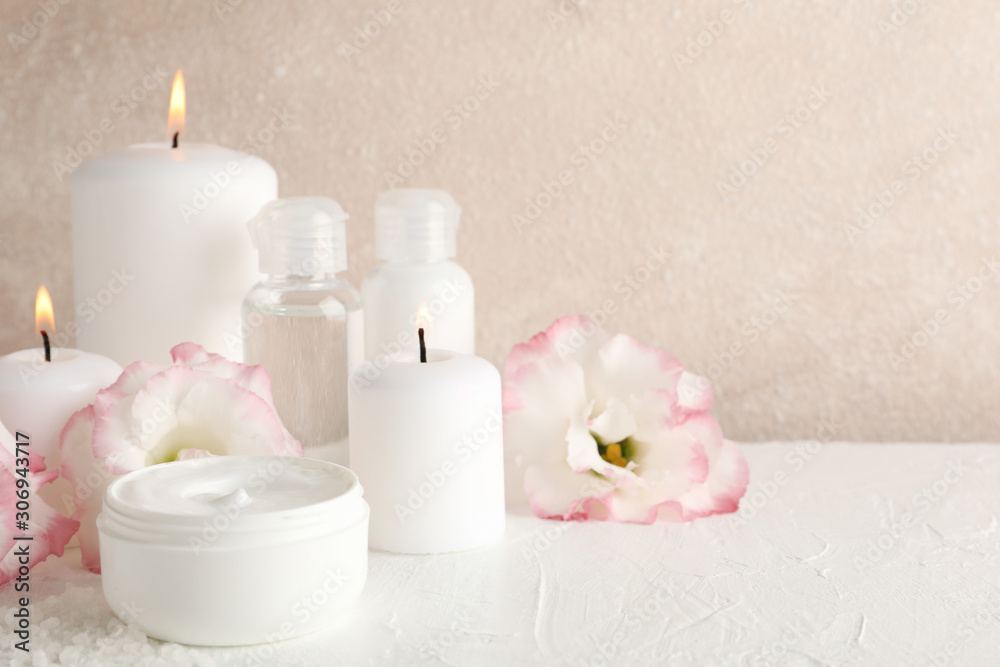 Spa accessories and beautiful flowers on white background, close up