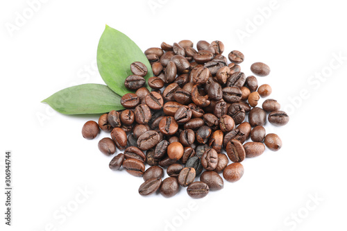 Heap of coffee beans and leaves isolated on white background, close up