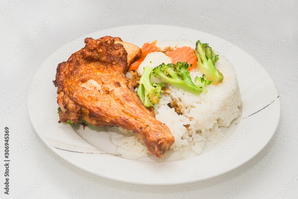 A hong kong-style Fried chicken rice on a white background A hong kong-style Fried chicken rice on a white background