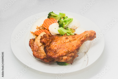 A hong kong-style Fried chicken rice on a white background
