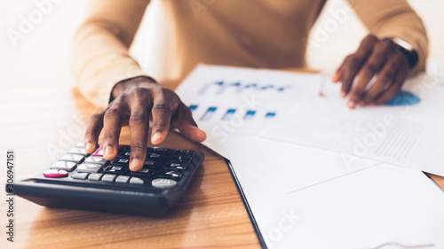 African american accountant calculating budget of the company photo