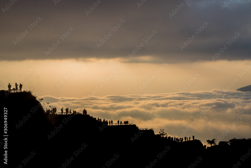 Scenic view of clouds and mist at sunrise
