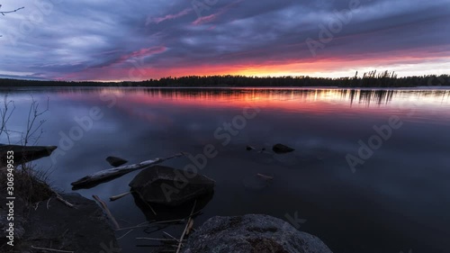 A time lapse of a storm moving at sunset while next to a lake in Northwest Ontario, Canada. 