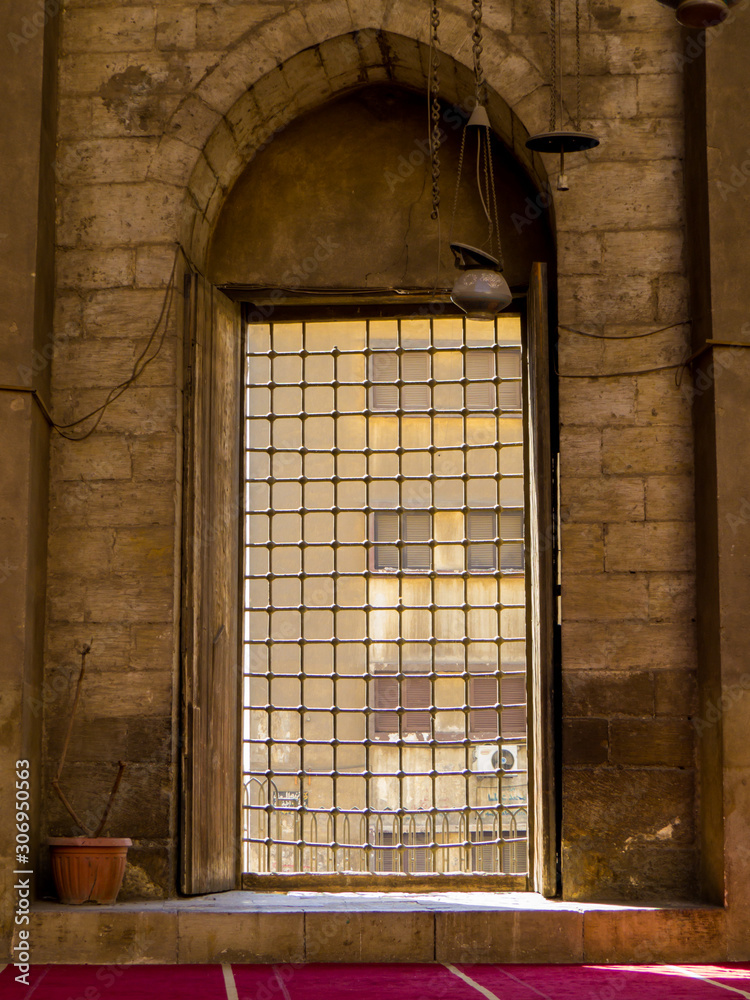 Cairo, Egypt - November 2, 2019: Window in the Mosque-Madrassa of Sultan Hassan.