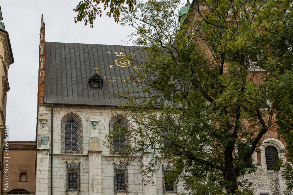 Golden letters on roof. View of Wawel castle in Krakow