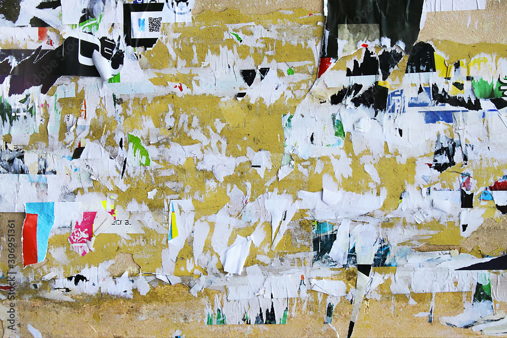 Fototapeta premium Dirty street yellow wall with old torn and peeling poster paper