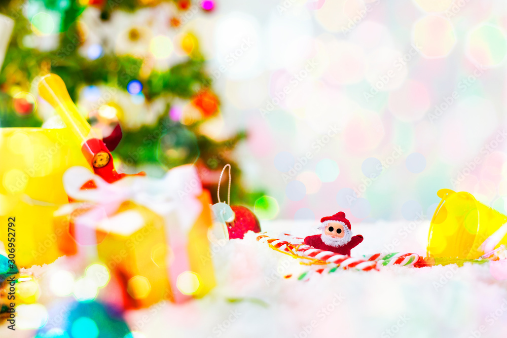 Christmas background Santa Claus in red suit with white snowy scenes and Christmas tree on abstract bokeh glitter background