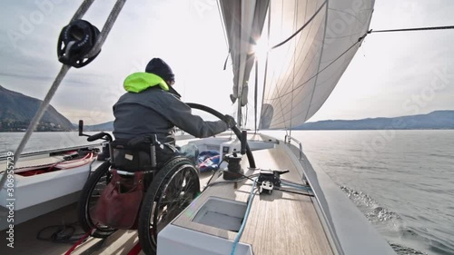 Person with disability drives a sailboat