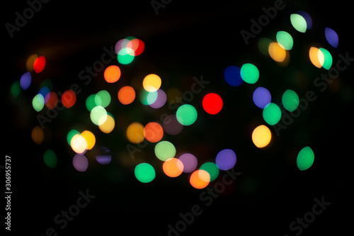 blur light bokeh color red green yellow on background black.