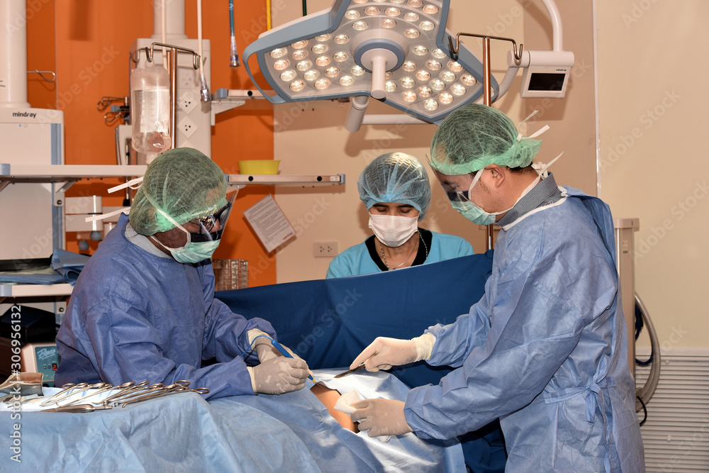 Medical Team Performing Surgical Operation in Modern Operating Room ...