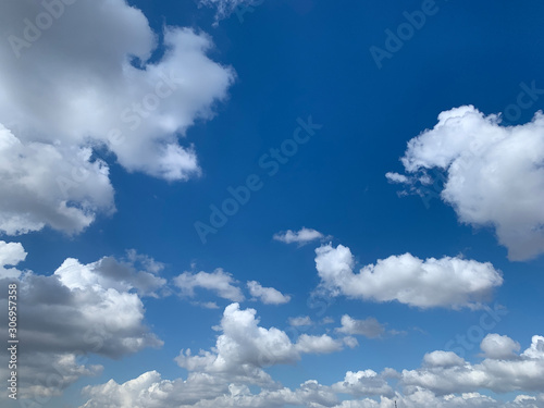 View of big clouds and blue sky. © theendup