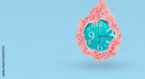 Clock in pink paint splahes. Time management cocept. Ink Splashes. photo