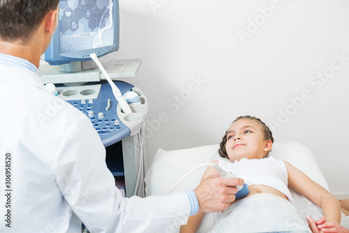 Medical examination of smiling little girl