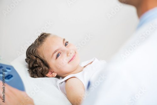 Medical procedure of smiling little girl