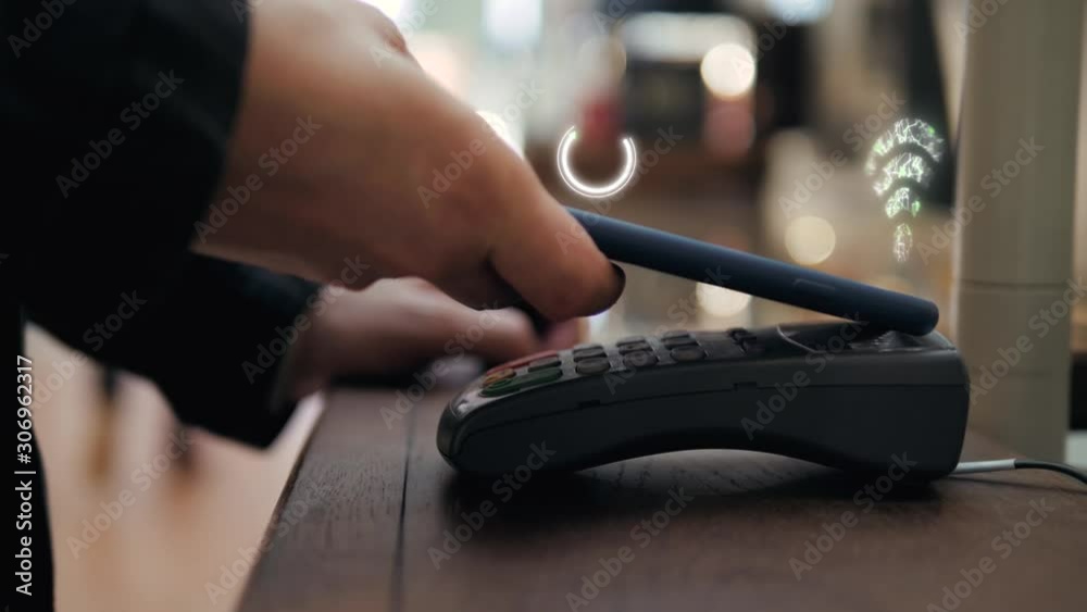 Animation 3d motion design of Customer is paying with smartphone in shop using NFC contactless technology. NFC technology. Phone banking payment