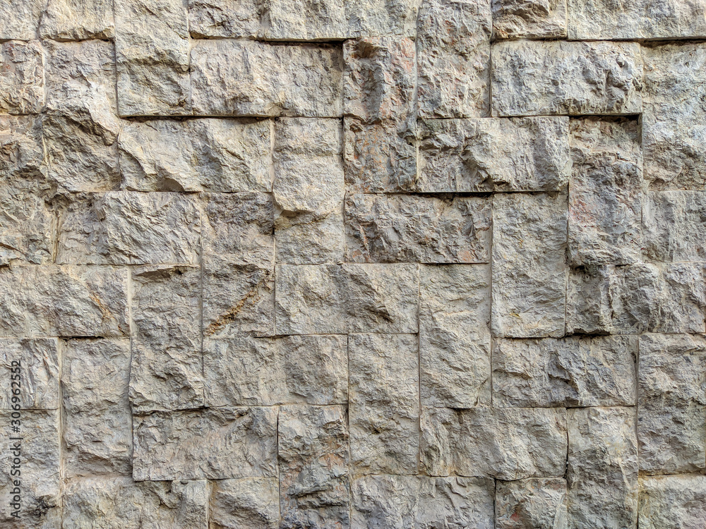 Modern and good looking white stone rock bricks on an outside wall as interesting decoration style Modern and good looking white stone rock bricks on an outside wall as interesting decoration style