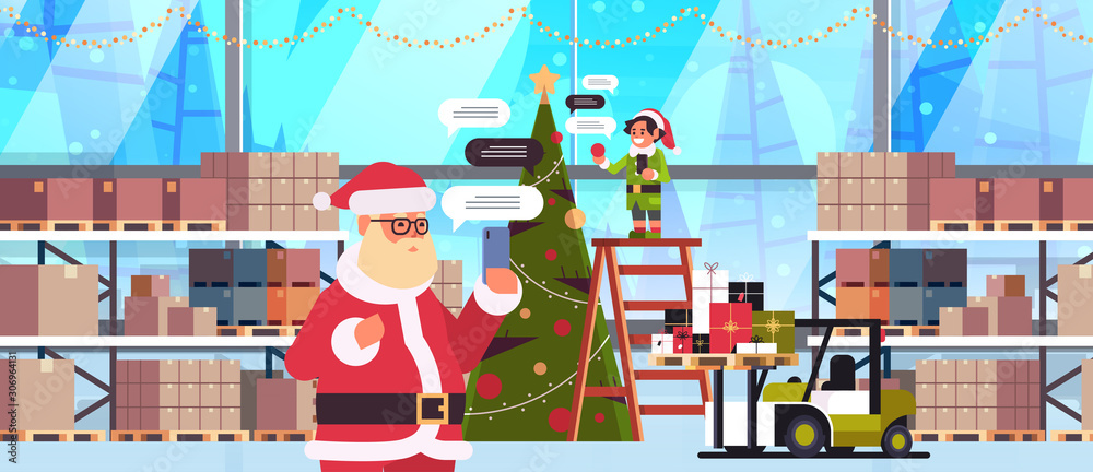 santa with male elf helper chatting using mobile app on smartphone social network chat bubble communication concept modern warehouse interior portrait horizontal vector illustration