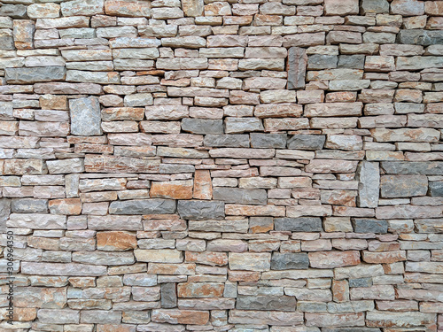 Modern style of horizontal stone rock bricks making an interesting wall made of natural material for good looking exterior facade