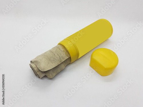 Reusable Yellow Used Dirty Industrial Kanebo Rubber Cleaning Cloth in White Isolated Background photo