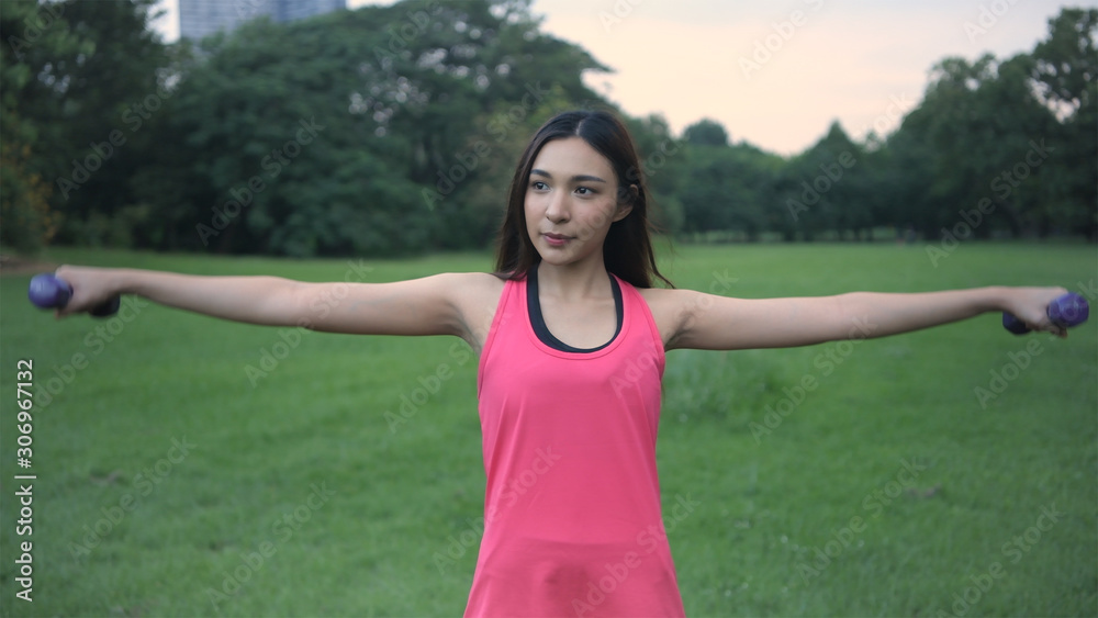 Exercise concepts. Beautiful women are exercising to build strong muscles in the garden. 4k Resolution. Exercise concepts. Beautiful women are exercising to build strong muscles in the garden. 4k Resolution.