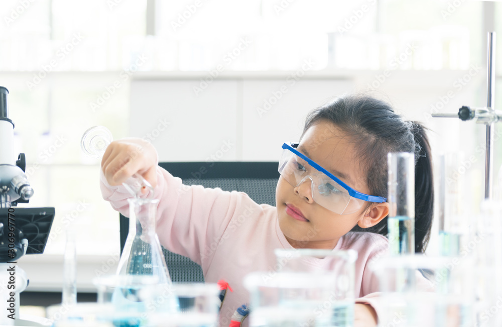 little asia kids girl in lab learning chemistry in. little asia kids girl in lab learning chemistry in.