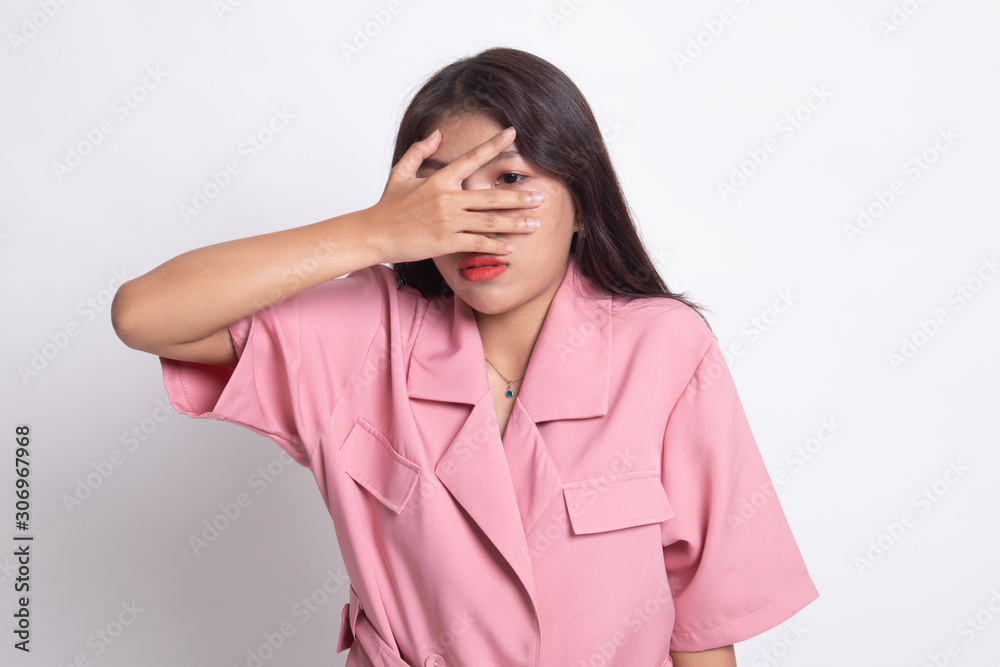 Beautiful young Asian woman peeking through fingers. Beautiful young Asian woman peeking through fingers.
