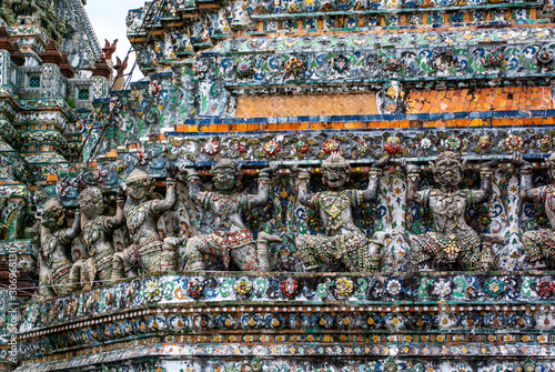 Yaksha around base of Prang at Wat Arun, Bangkok, Thailand © Josh