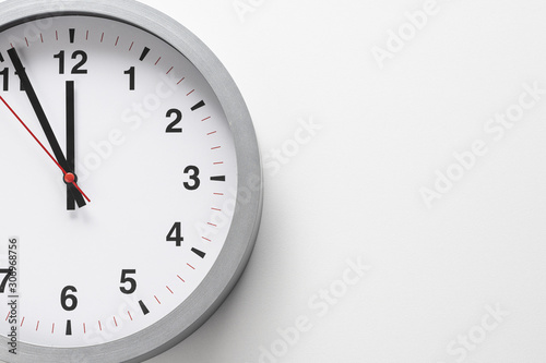 5 to 12 clock concept on white background