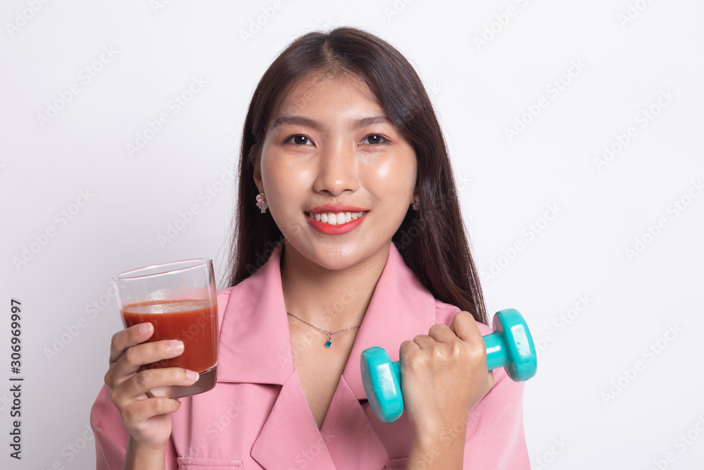 Healthy Asian woman with dumbbell and tomato juice. Healthy Asian woman with dumbbell and tomato juice.