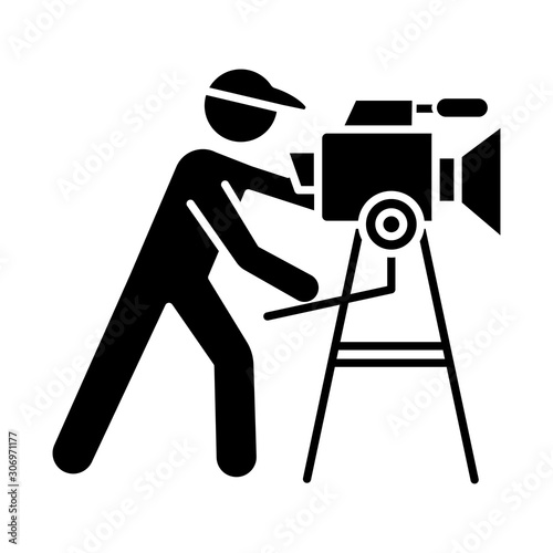 Film industry glyph icon. Cinema business. Cinematography. Operator filming scene. Filmmaking. Moviemaking. Video production. Silhouette symbol. Negative space. Vector isolated illustration