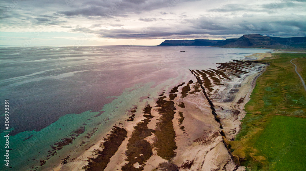 Shallow Ridge High aerial of a sequence of sedimentary rock layers that progress from ...
