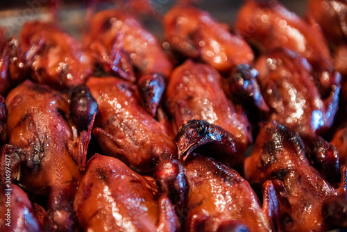 Fried pigeons in a food market in Beijing, China.