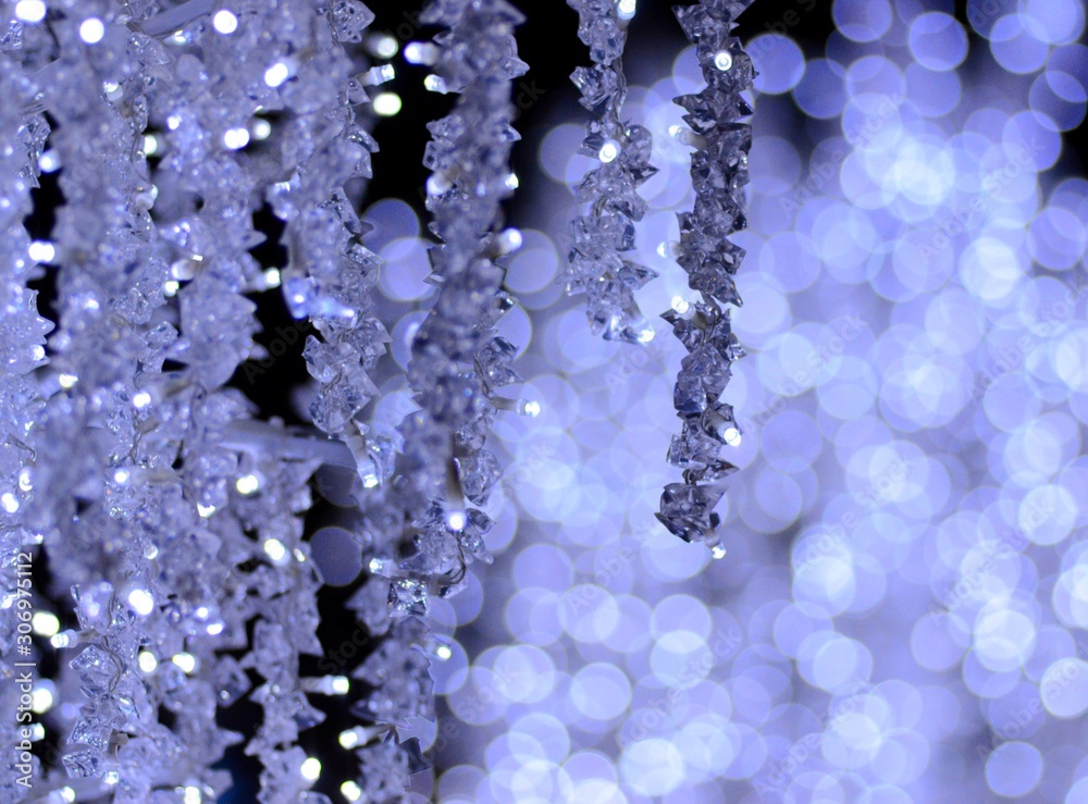 Festive abstract background from glare on a blue background, Christmas and New Year style, fabulous illumination from garlands Festive abstract background from glare on a blue background, Christmas and New Year style, fabulous illumination from garlands