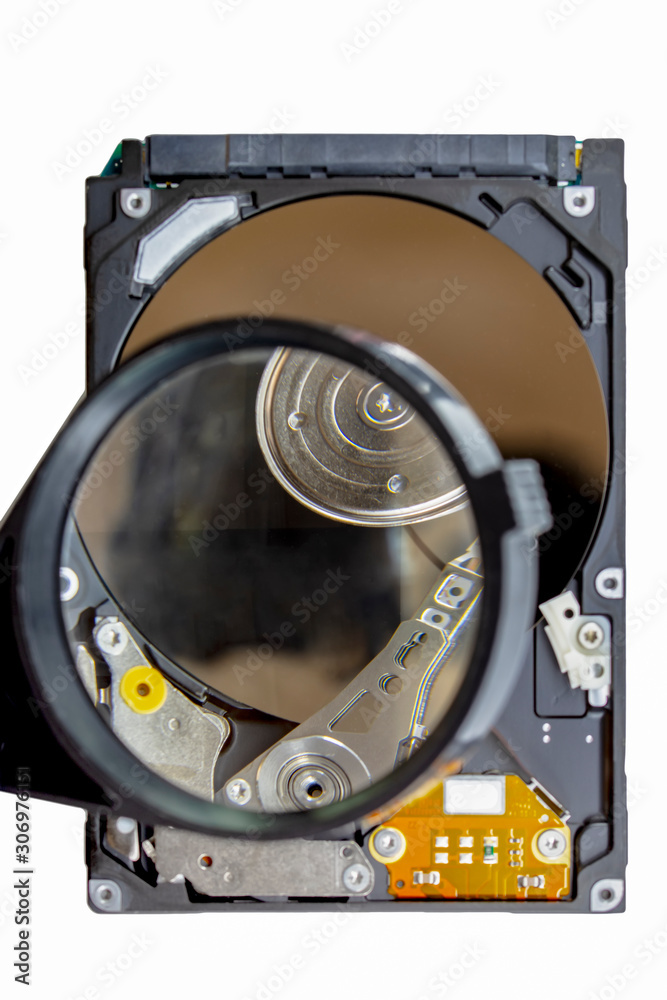 Disassembled hard drive from the computer, hdd with mirror effect. Opened hard drive from the computer hdd disk drive with mirror effects. Part of computer pc, laptop. Disassembled hard drive from the computer, hdd with mirror effect. Opened hard drive from the computer hdd disk drive with mirror effects. Part of computer pc, laptop.