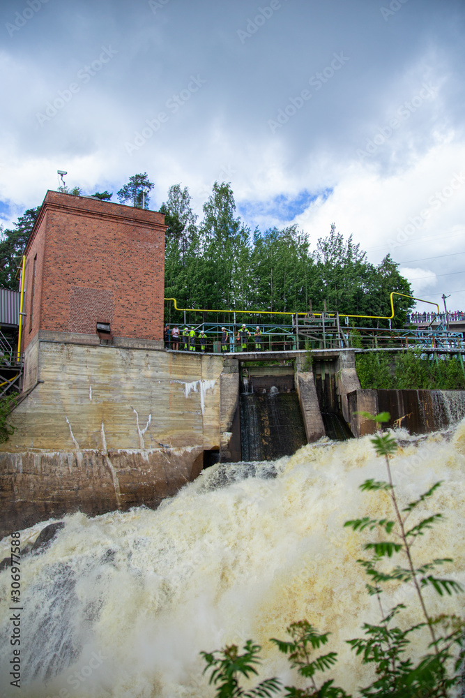 Finnish river running wild in the nature. Close photos of powerful water streams. Finnish river running wild in the nature. Close photos of powerful water streams.