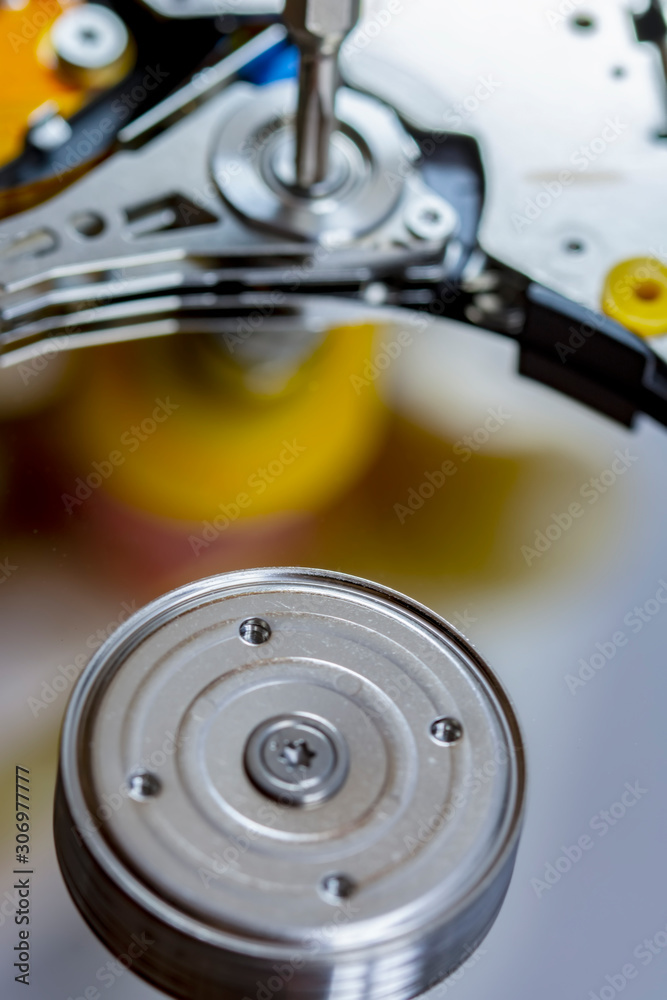 Disassembled hard drive from the computer, hdd with mirror effect. Opened hard drive from the computer hdd disk drive with mirror effects. Part of computer pc, laptop. Disassembled hard drive from the computer, hdd with mirror effect. Opened hard drive from the computer hdd disk drive with mirror effects. Part of computer pc, laptop.