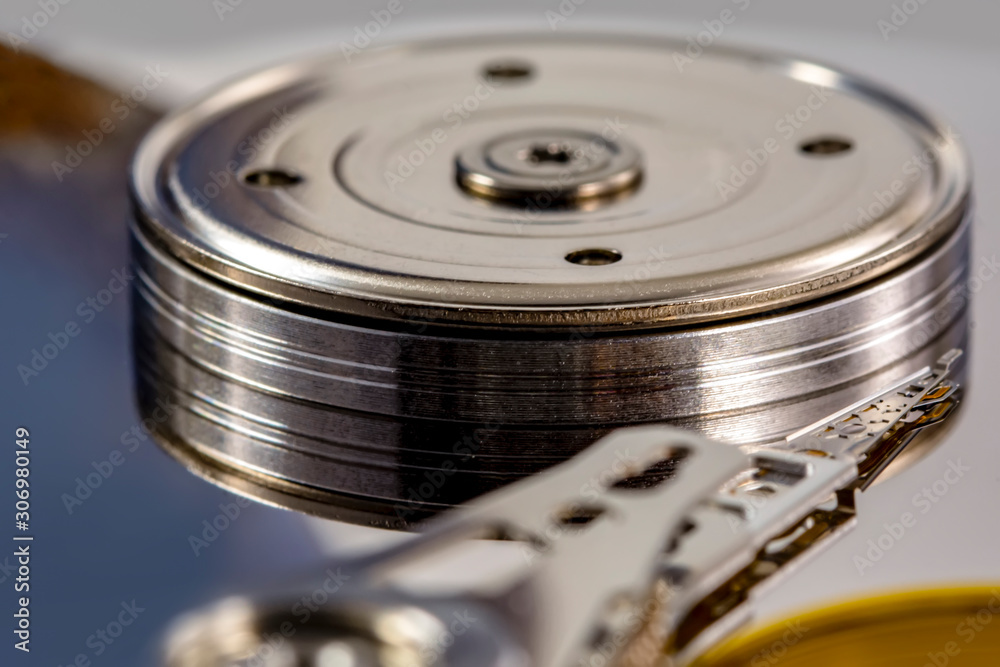 Disassembled hard drive from the computer, hdd with mirror effect. Opened hard drive from the computer hdd disk drive with mirror effects. Part of computer pc, laptop. Disassembled hard drive from the computer, hdd with mirror effect. Opened hard drive from the computer hdd disk drive with mirror effects. Part of computer pc, laptop.