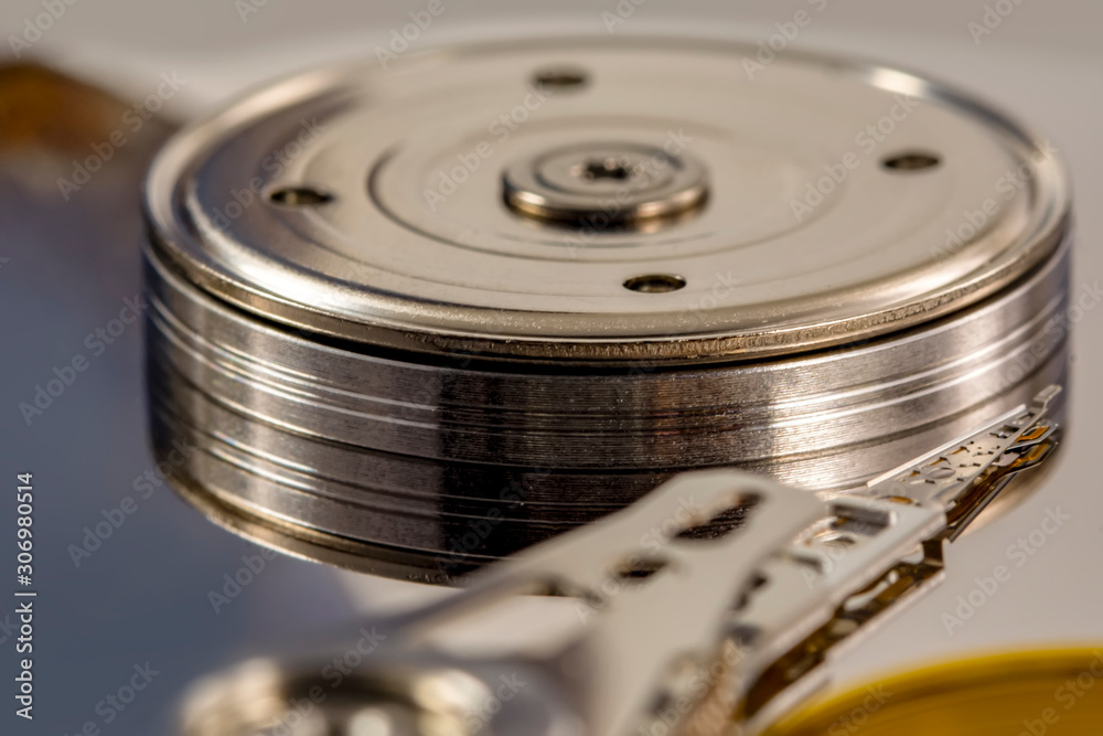 Disassembled hard drive from the computer, hdd with mirror effect. Opened hard drive from the computer hdd disk drive with mirror effects. Part of computer pc, laptop. Disassembled hard drive from the computer, hdd with mirror effect. Opened hard drive from the computer hdd disk drive with mirror effects. Part of computer pc, laptop.