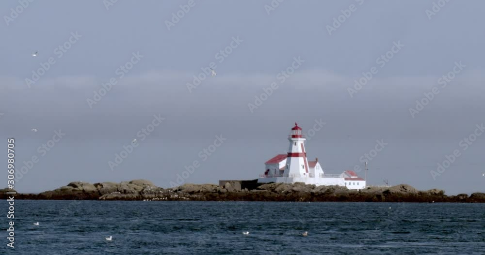 Handheld shot of a lighthouse on the coastline Handheld shot of a lighthouse on the coastline
