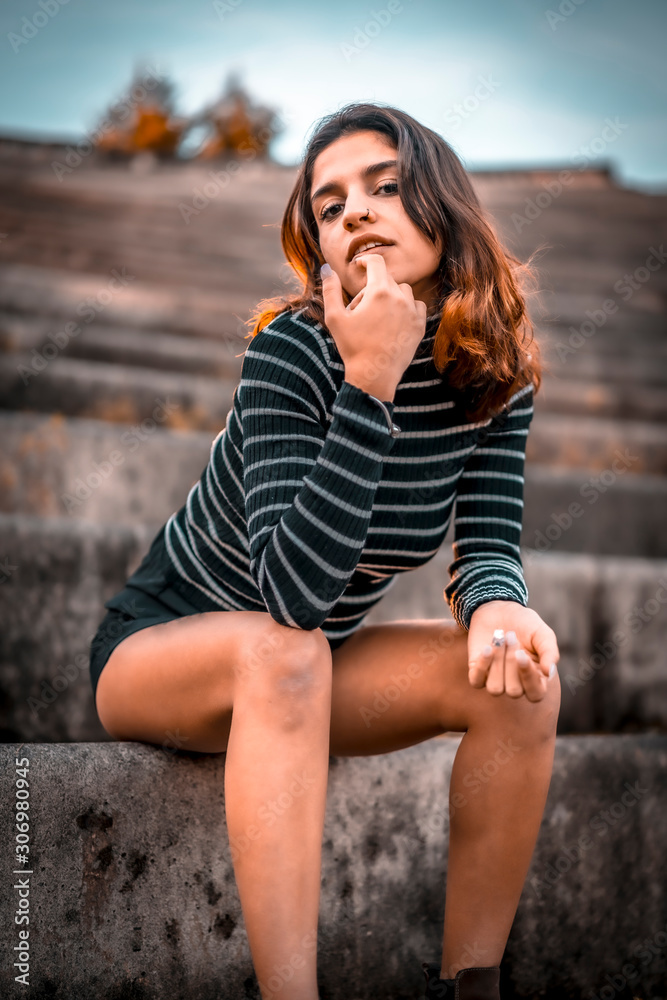 Lifestyle shooting, a young brunette with red wicks