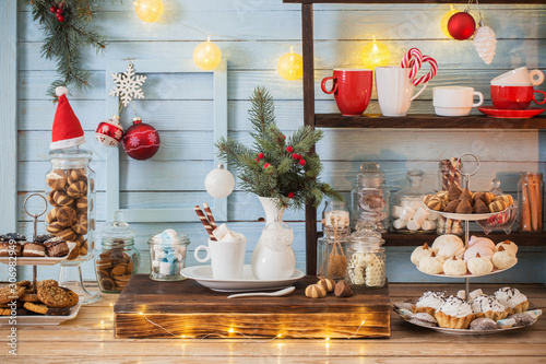 Christmas bar cacao decoration with cookies and sweets on blue w