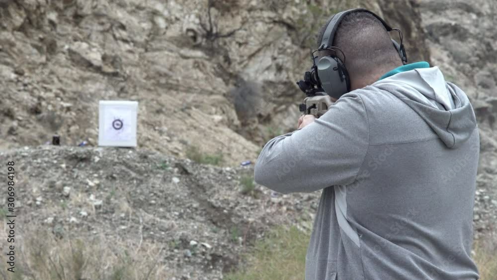 Man shooting semi automatic pistol at target with audio.mov